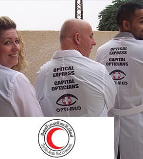Three opticians with Optical Express coats and Syrian Arab Red Crescent logo