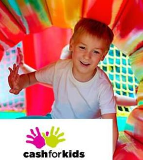 Boy at softplay with Cash for kids logo